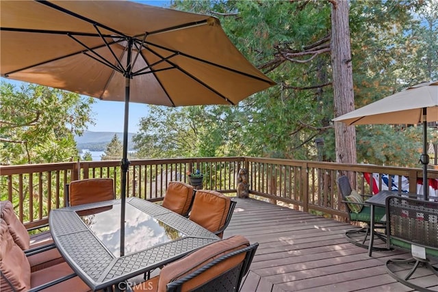 750 Zurich Dr, Lake Arrowhead, CA 92352 - wooden terrace with outdoor dining area and a mountain view