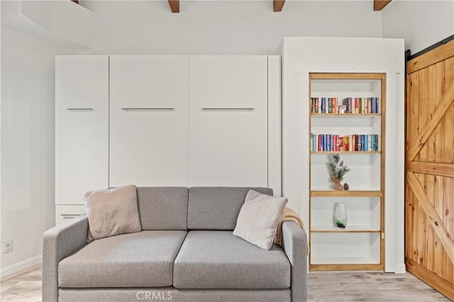 750 Zurich Dr, Lake Arrowhead, CA 92352 - living area featuring a barn door, light wood finished floors, and beam ceiling