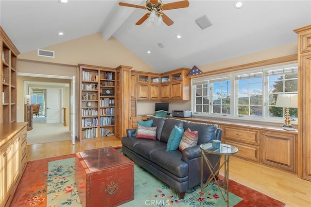 living room with recessed lighting, visible vents, light wood-type flooring, beam ceiling, and built in desk