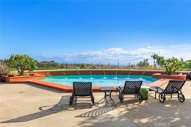 outdoor pool featuring a patio area