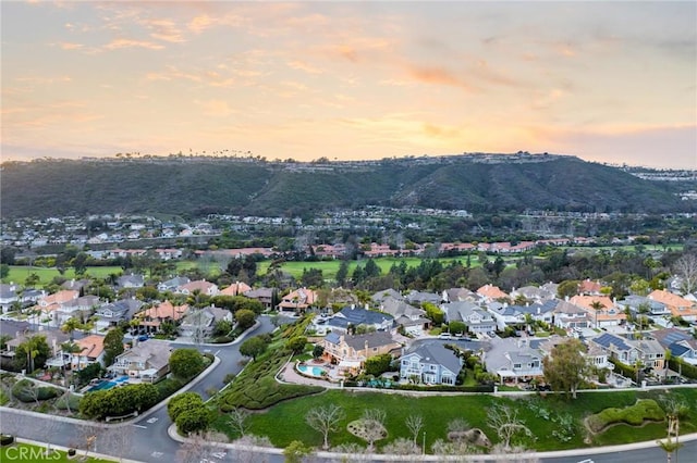 birds eye view of property featuring a mountain view and a residential view