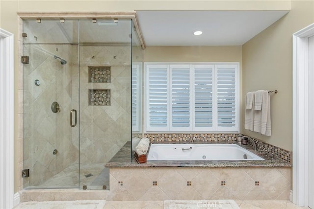 full bath featuring a stall shower and a bath