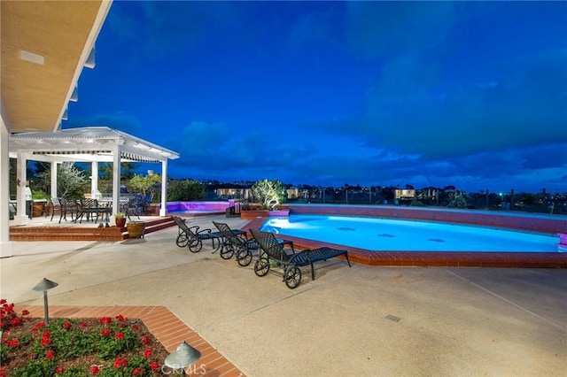 outdoor pool featuring a patio area and a pergola