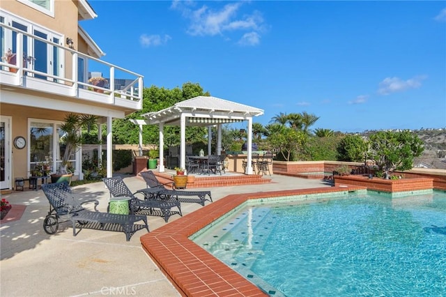 pool featuring a patio and a pergola