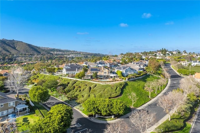 birds eye view of property with a mountain view and a residential view