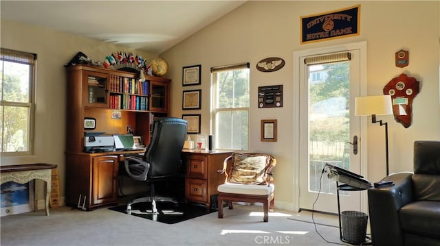 office space featuring lofted ceiling and light carpet