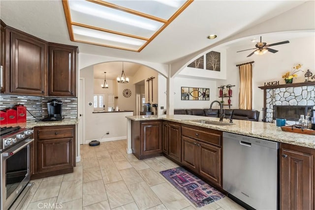 892 Breithorn Dr, Lake Arrowhead, CA 92352 - kitchen featuring a sink, vaulted ceiling, open floor plan, and stainless steel appliances