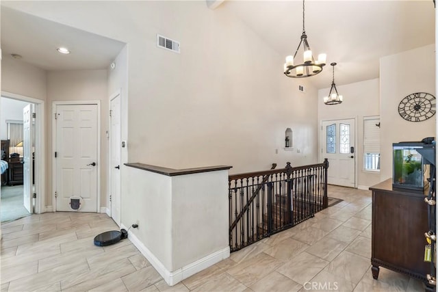 892 Breithorn Dr, Lake Arrowhead, CA 92352 - entrance foyer with a chandelier, high vaulted ceiling, and visible vents