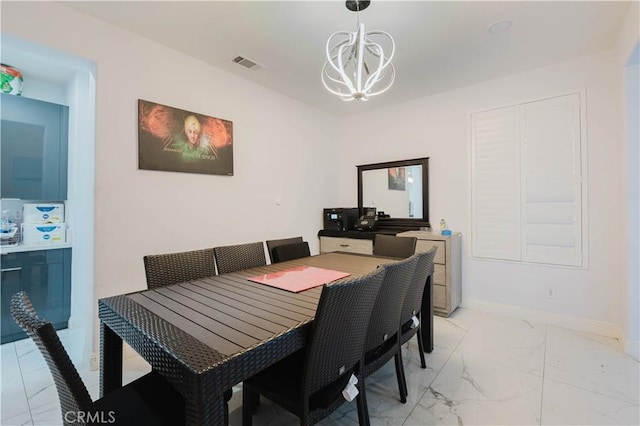 dining area with a chandelier, marble finish floor, visible vents, and baseboards