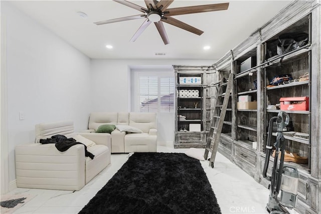 living area featuring visible vents, marble finish floor, a ceiling fan, and recessed lighting