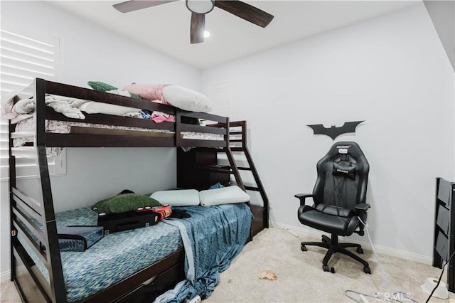 bedroom featuring carpet floors, baseboards, and a ceiling fan