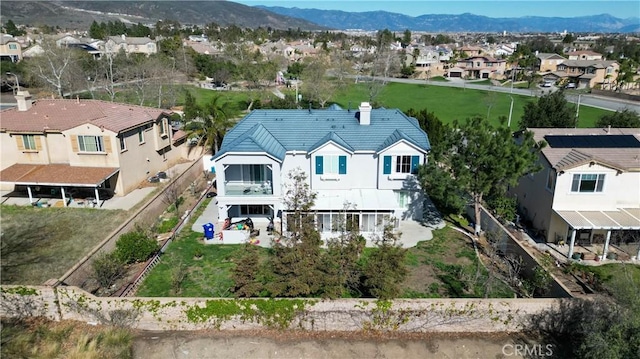 drone / aerial view featuring a mountain view and a residential view