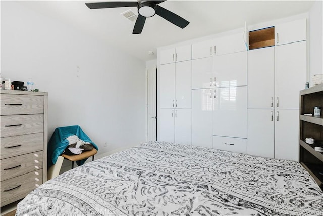 bedroom featuring a closet, visible vents, and a ceiling fan