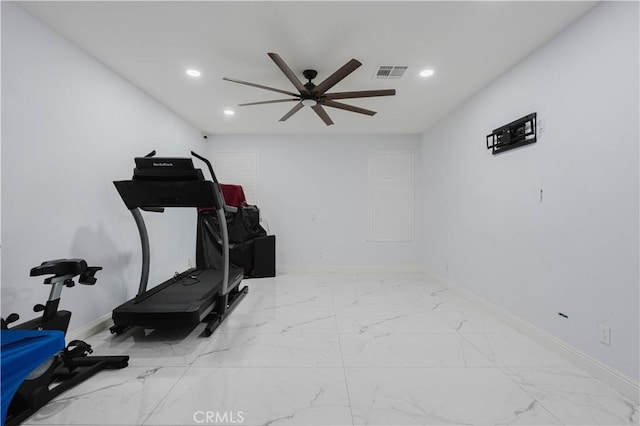 exercise room with marble finish floor, visible vents, and recessed lighting