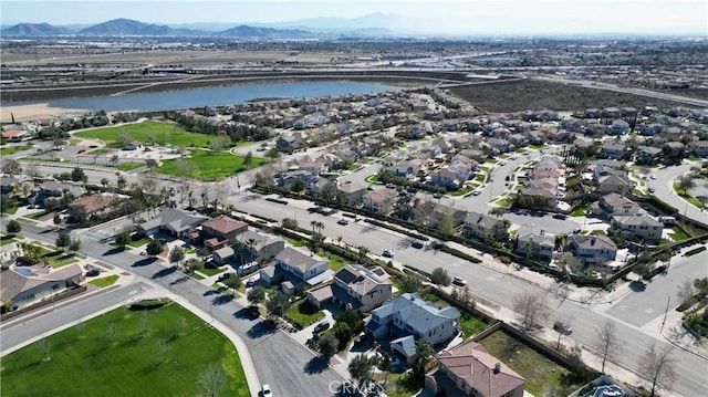 bird's eye view featuring a residential view and a water and mountain view