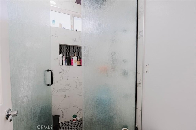 bathroom featuring a stall shower