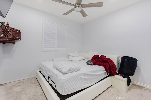 bedroom featuring a ceiling fan, carpet flooring, and baseboards