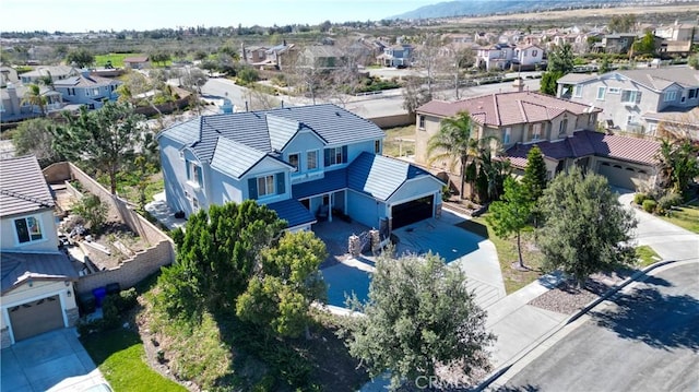 birds eye view of property with a residential view