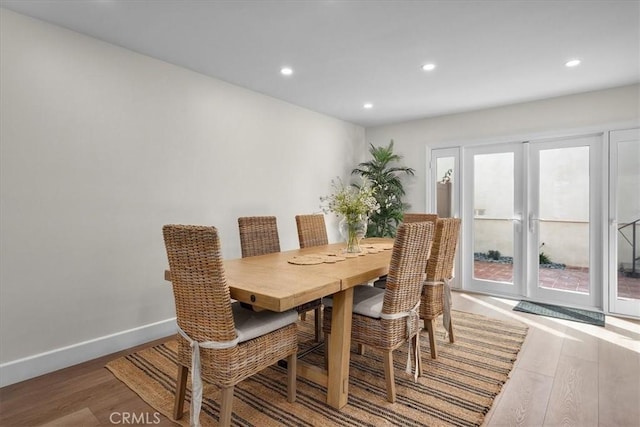 dining space featuring recessed lighting, french doors, baseboards, and wood finished floors