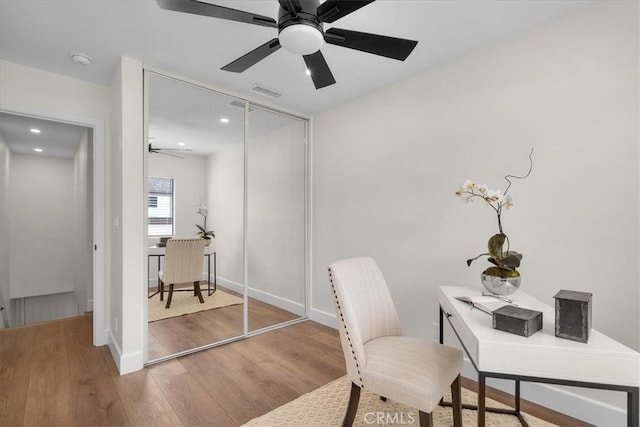 office featuring recessed lighting, visible vents, a ceiling fan, wood finished floors, and baseboards