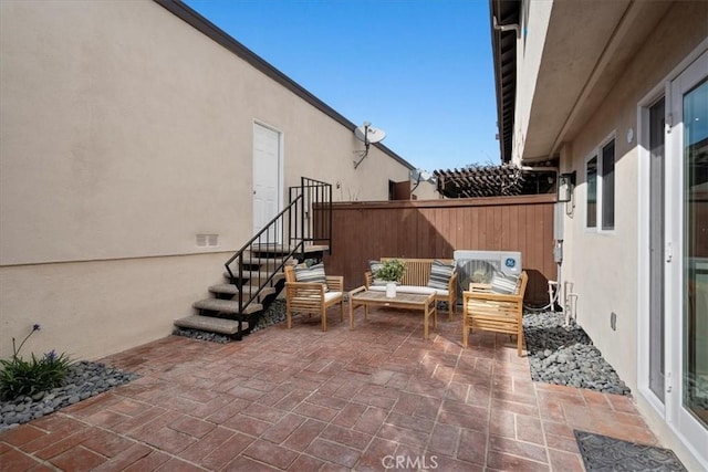 view of patio / terrace featuring fence