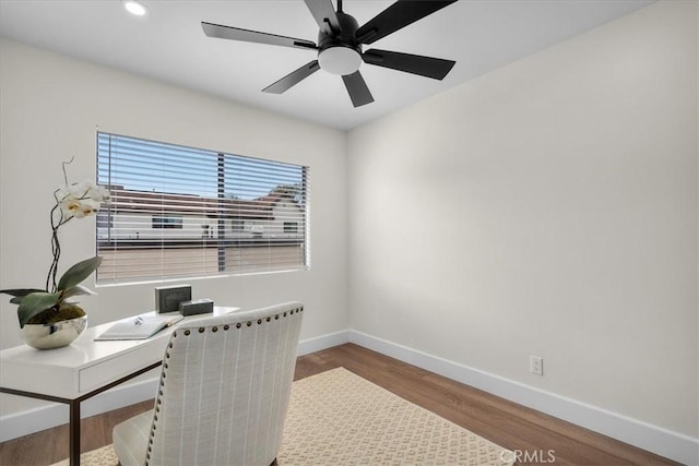 office space with recessed lighting, wood finished floors, a ceiling fan, and baseboards