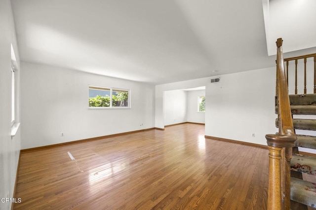 205 Bluefield Ave, Newbury Park, CA 91320 - empty room featuring plenty of natural light, stairs, wood finished floors, and baseboards