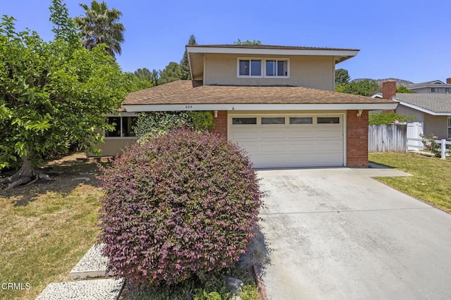 205 Bluefield Ave, Newbury Park, CA 91320 - traditional home featuring driveway, an attached garage, brick siding, and a shingled roof
