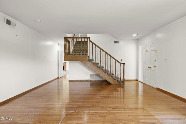 205 Bluefield Ave, Newbury Park, CA 91320 - entryway featuring stairs, wood finished floors, and baseboards