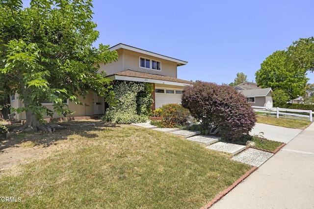 205 Bluefield Ave, Newbury Park, CA 91320 - obstructed view of property featuring a garage and stucco siding