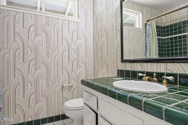 205 Bluefield Ave, Newbury Park, CA 91320 - bathroom featuring wallpapered walls, toilet, vanity, tile patterned floors, and a shower with curtain