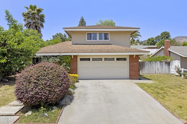 205 Bluefield Ave, Newbury Park, CA 91320 - traditional-style house with concrete driveway, a garage, brick siding, and roof with shingles
