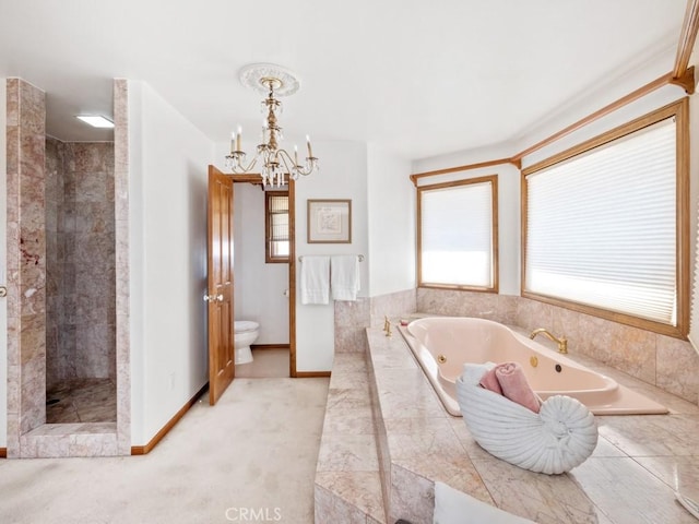 full bathroom featuring toilet, baseboards, a jetted tub, a tile shower, and an inviting chandelier