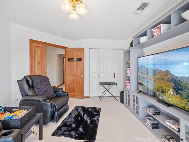 living room with a chandelier, light colored carpet, and visible vents