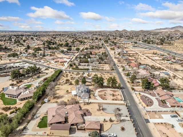 bird's eye view featuring a residential view, a mountain view, and view of desert