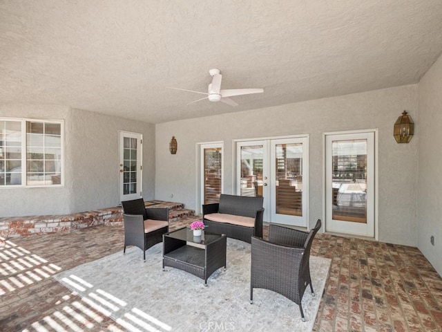 view of patio / terrace featuring ceiling fan, outdoor lounge area, and french doors