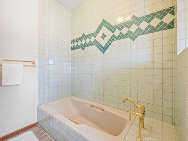 full bathroom featuring tiled bath