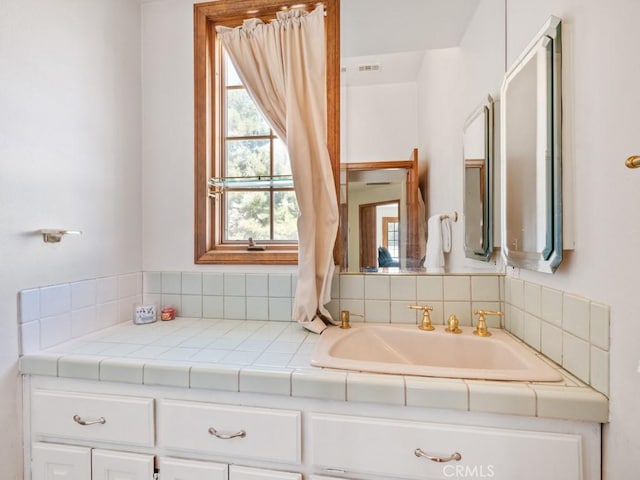 bathroom with a sink and visible vents