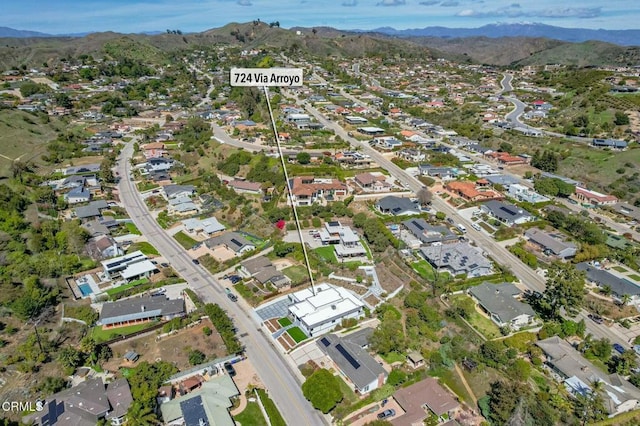 drone / aerial view with a residential view and a mountain view