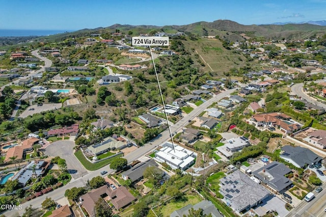 birds eye view of property featuring a mountain view and a residential view