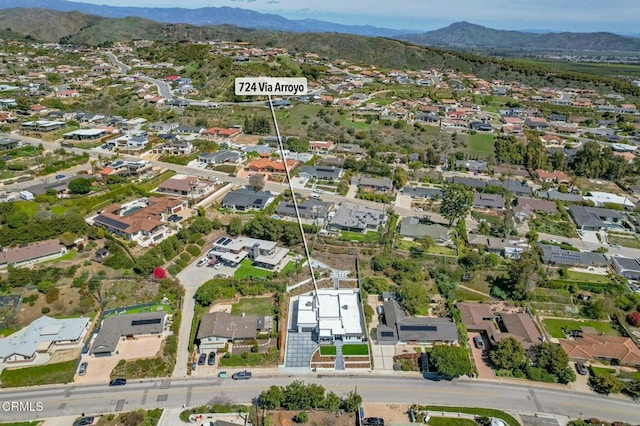 drone / aerial view with a residential view and a mountain view