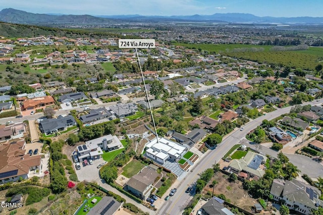 drone / aerial view with a residential view and a mountain view