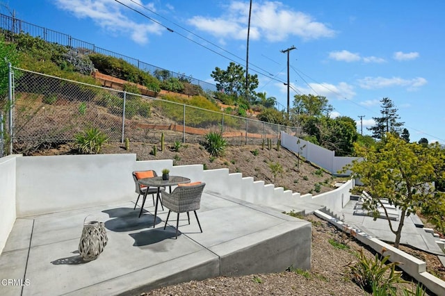 view of patio / terrace featuring outdoor dining space and a fenced backyard