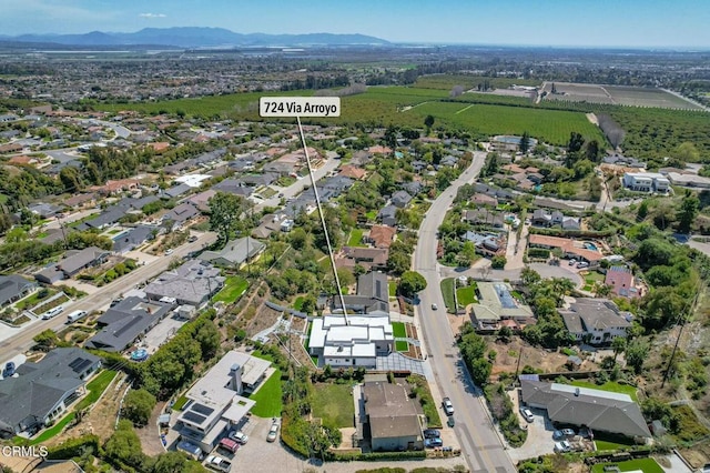 724 Via Arroyo, Ventura, CA 93003 - aerial overview of property's location featuring a mountain backdrop and nearby suburban area