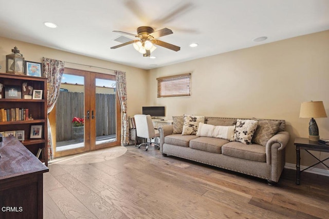 living area with a ceiling fan, recessed lighting, french doors, and hardwood / wood-style flooring