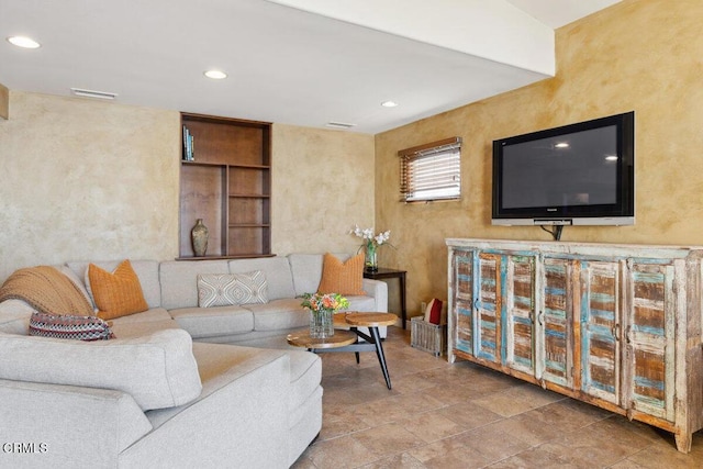 living area with visible vents and recessed lighting