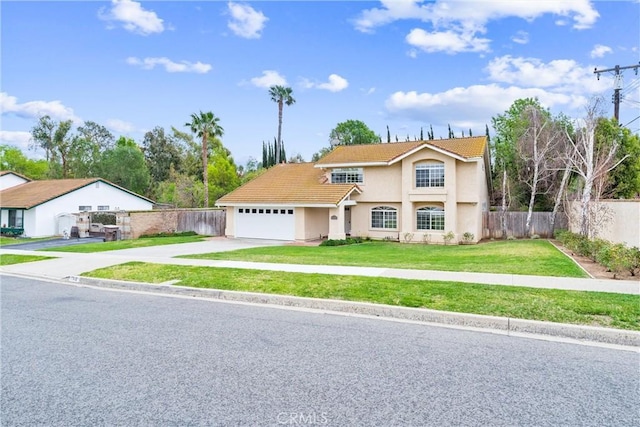 view of front of home with a tile roof, an attached garage, fence, driveway, and a front lawn