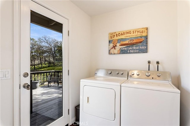 clothes washing area with laundry area and washer and clothes dryer