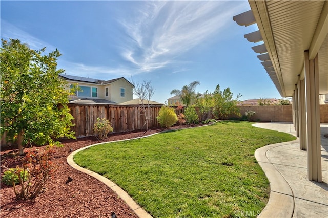 view of yard with a fenced backyard and a patio