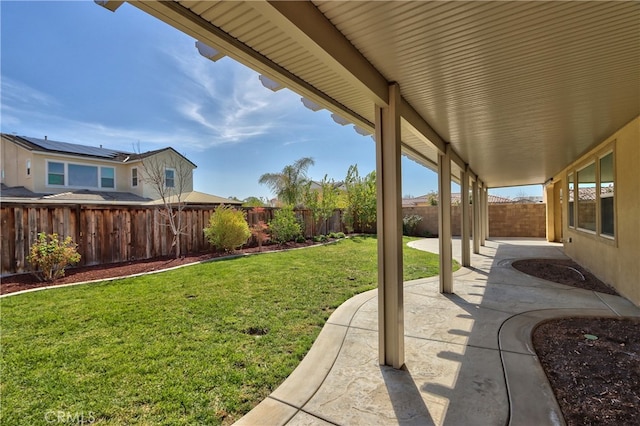 view of yard featuring a patio and a fenced backyard